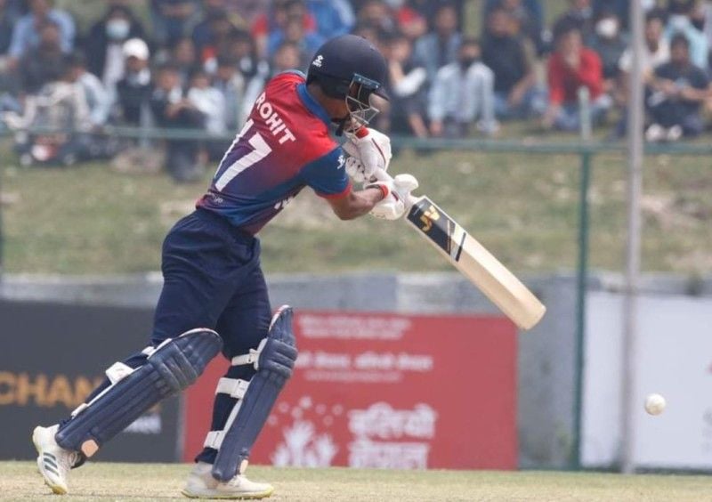 Rohit Paudel hitting a shot in a T20I match