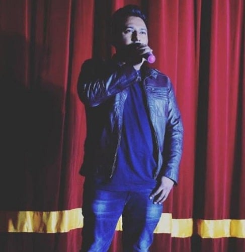 Romy performing on stage