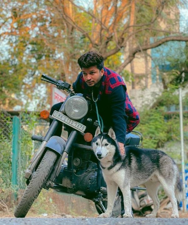 Roshan (Rosh) Gupta with a Husky