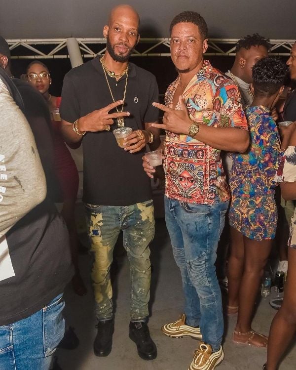 Roston Chase (left) enjoying alcoholic beverage with his friend