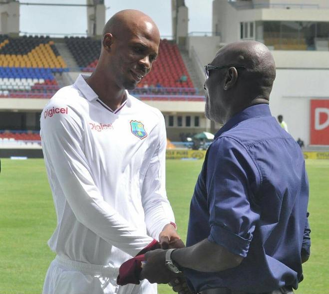 Roston Chase receving cap from Sir Vivian Richards