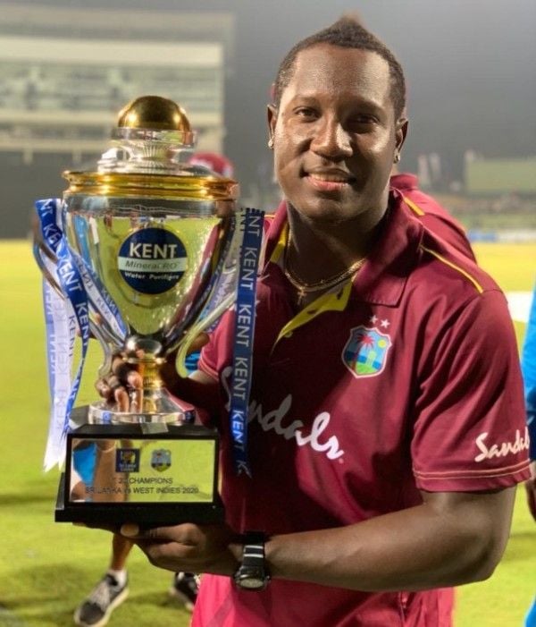 Rovman Powell posing with trophy after winning a T20 series as captain
