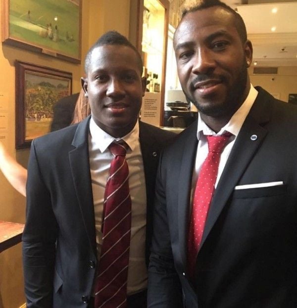 Rovman Powell with Andre Russell (right)