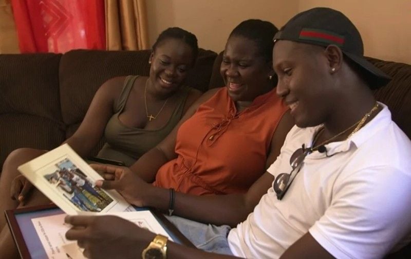 Rovman Powell with his mother and sister (right to left)