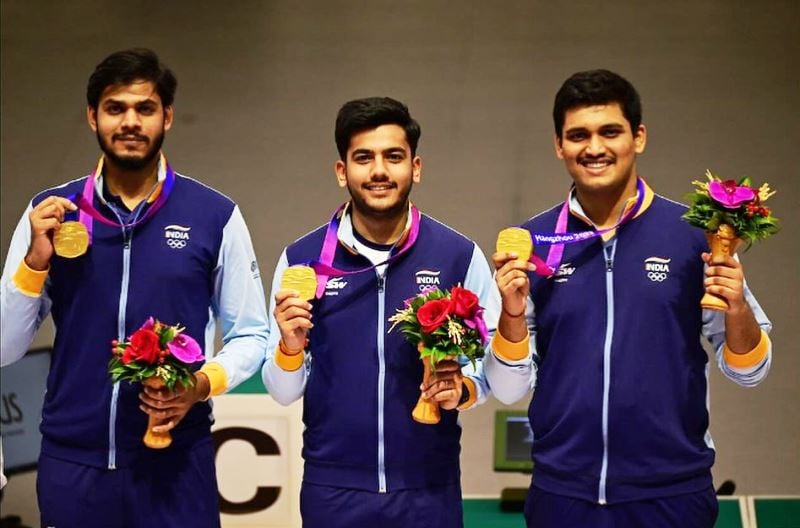 Rudrankksh Patil, Aishwary Pratap Singh Tomar, and Divyansh Singh Panwar after winning a gold medal for India in the men