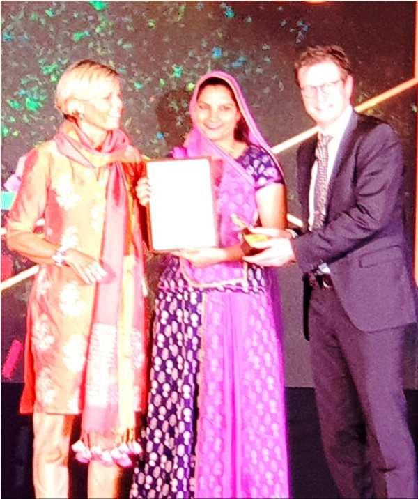 Ruma Devi Receiving an Award