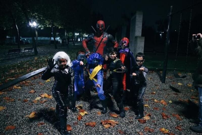 Ryan Reynolds (dressed as Deadpool) in a still from Trick-or-Treating to promote his character (2016)