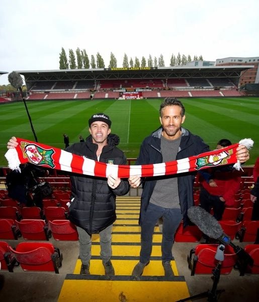 Ryan Reynolds (right) with actor Rob McElhenney at a match of their football club 