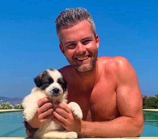 Ryan Serhant with a puppy