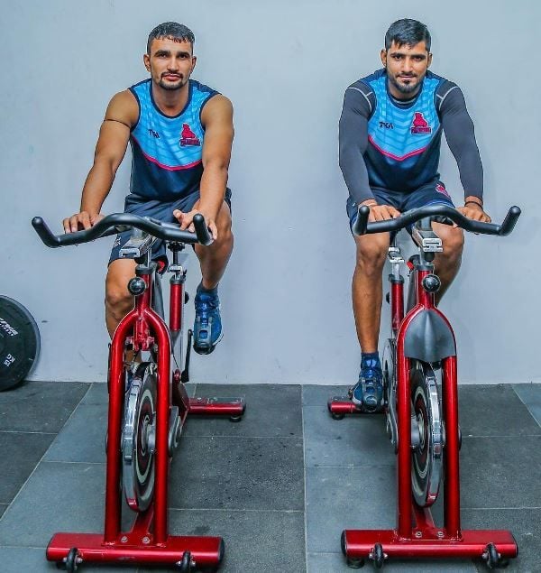 Sachin Narwal (left) while working out in a gym
