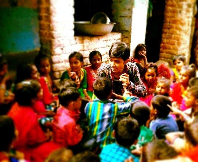 Safin Hasan (centre) with slum children