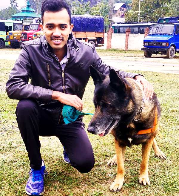 Safin Hasan with a dog from the K-9 unit