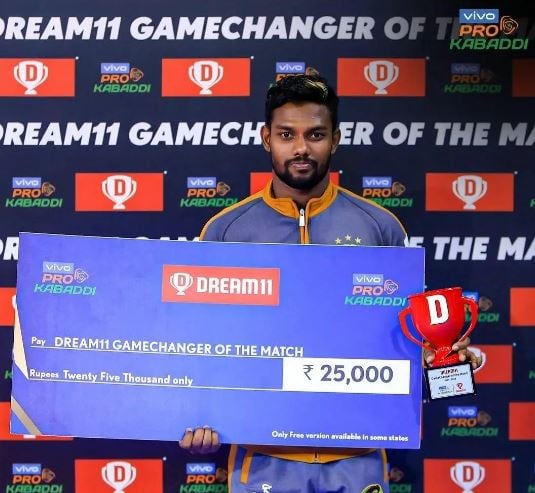 Sajin Chandrasekar posing with the cash prize during season 8 of the Pro Kabaddi League
