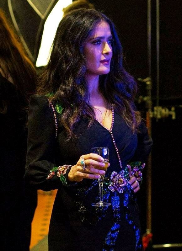 Salma Hayek while having champagne