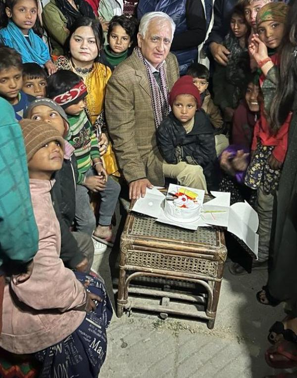 Salman Khurshid (in brown coat) during a charity program for children