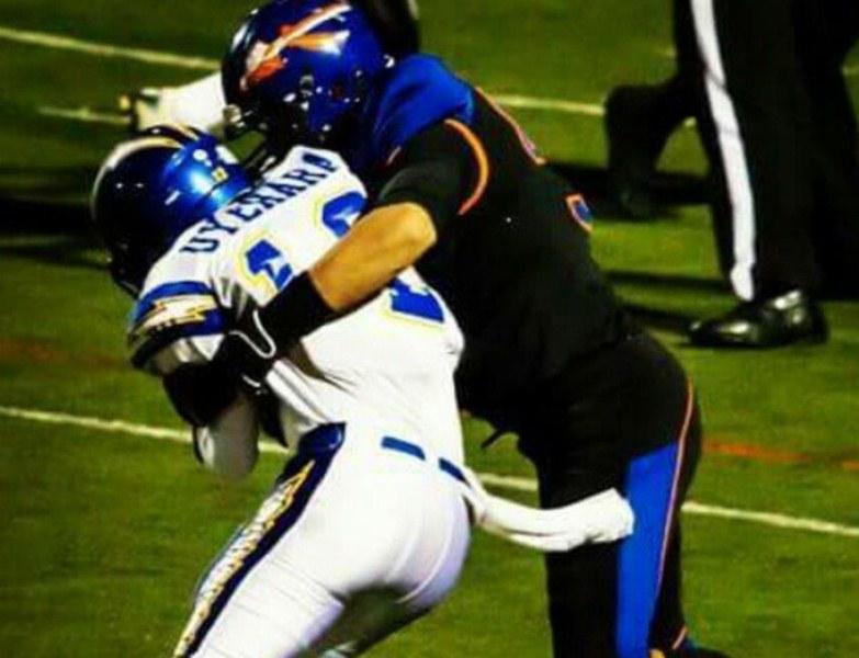 Sam Asghari (in black attire) during an American football match