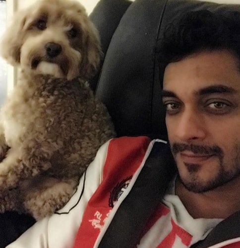 Sam Merchant with a dog