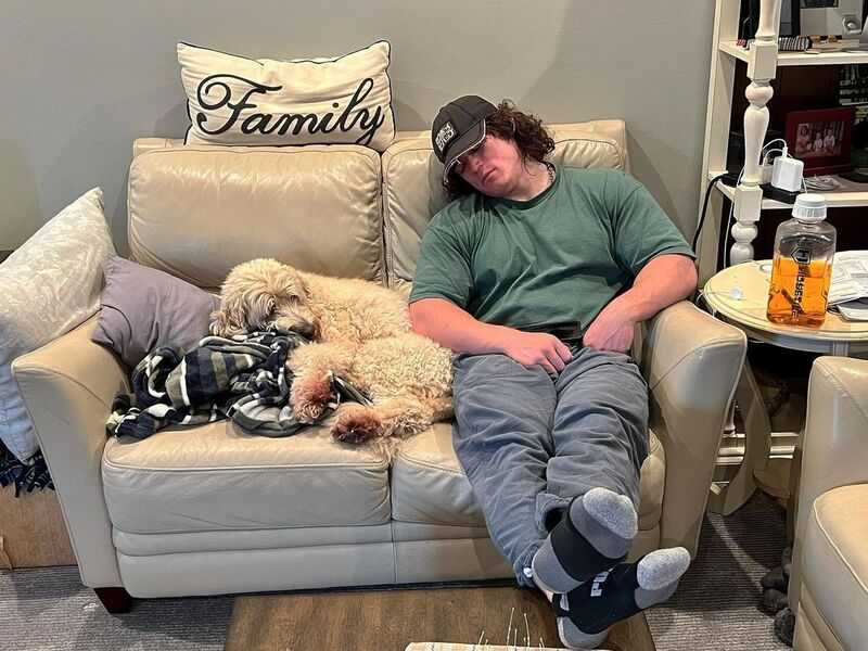 Sam Sulek with his pet dog