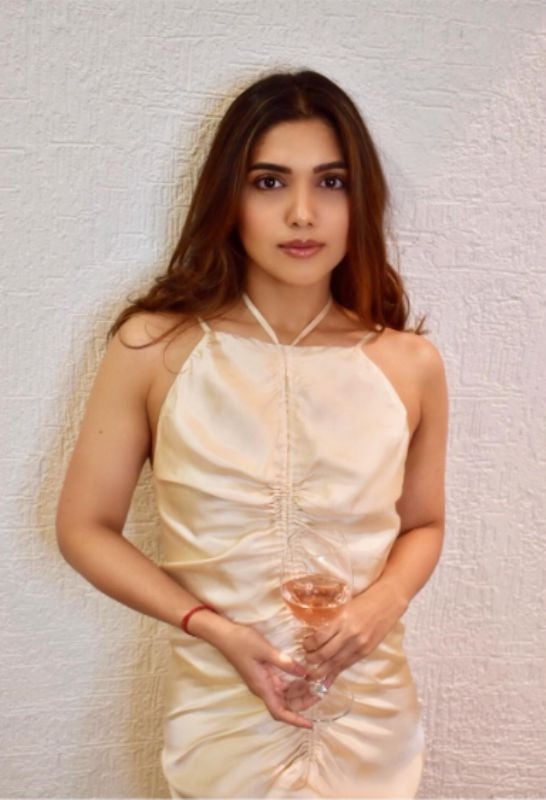 Samiksha Pednekar holding a glass of wine