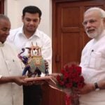 Sandeep Singh along with his grandfather Kalyan Singh and PM Narendra Modi