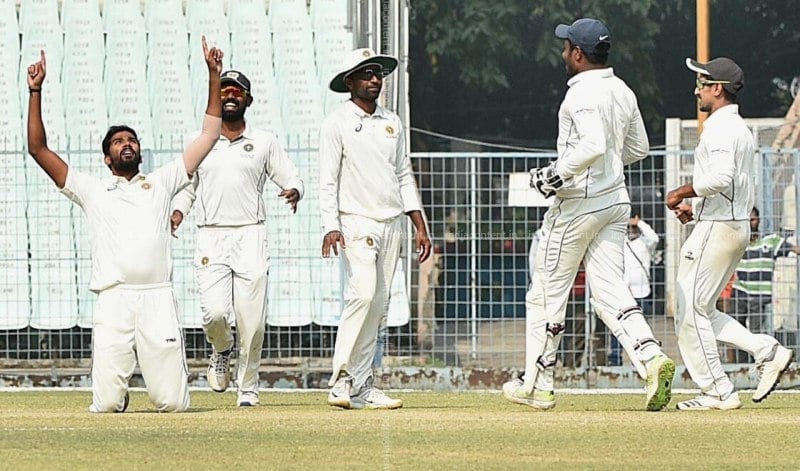 Sandeep Warrier celebrating after taking a wicket in a Ranji Trophy match