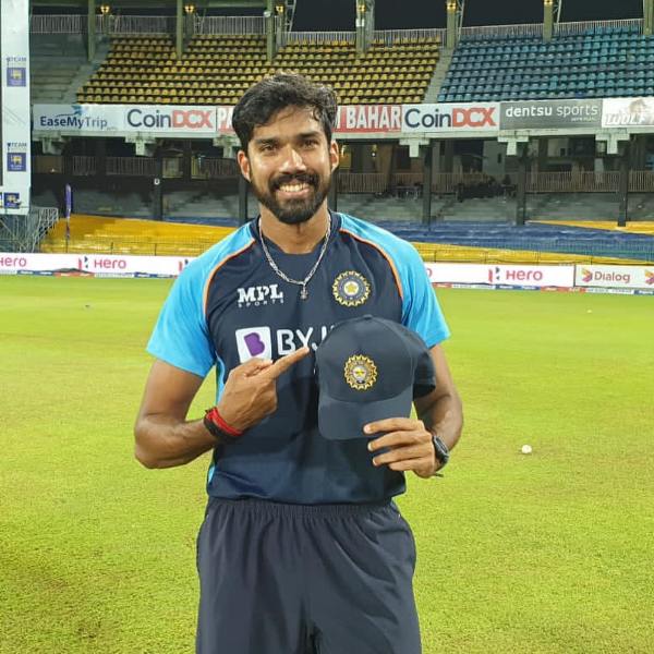 Sandeep Warrier posing with his debut cap with the Indian cricket team