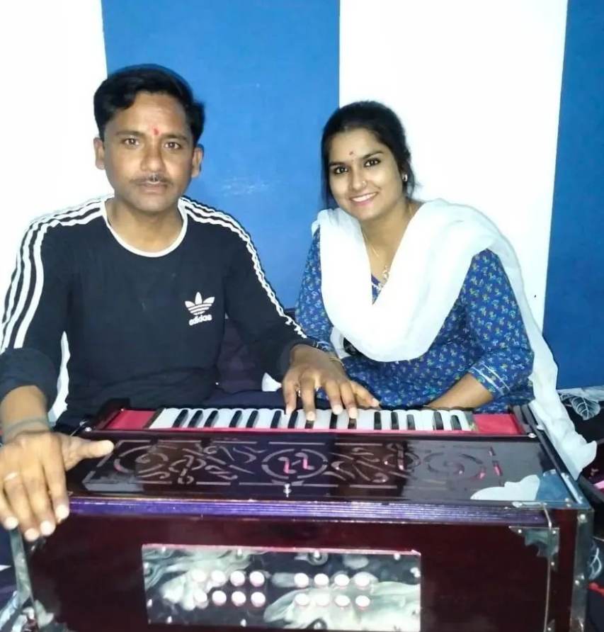 Sanjana practicing singing at home with her husband