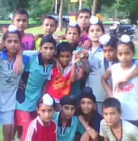 Sanjay standing in the back row, first from left