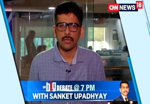 Sanket Upadhyay while hosting a show at News18