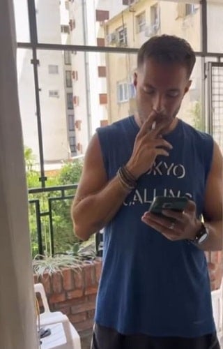 Santiago Larrivey smoking a cigarette