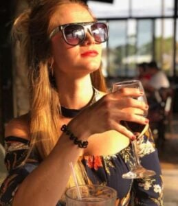 Sara Lee drinking wine