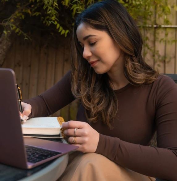 Sara Tendulkar writing in her yearly planner