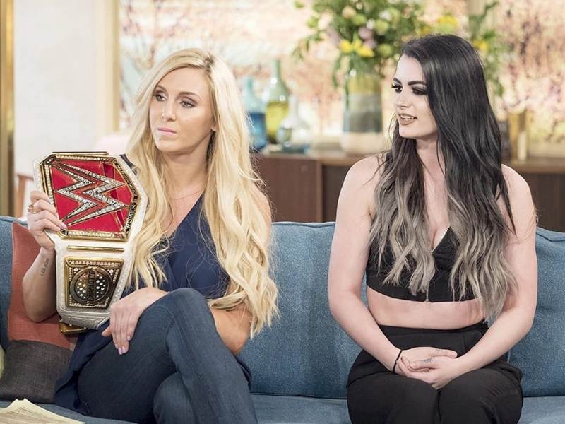 Saraya Bevis aka Paige with Charlotte Flair (left)