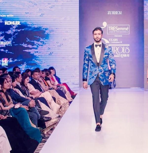 Sariful Razz wearing Zurheim in a fashion runway