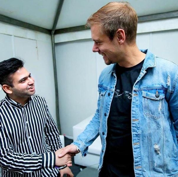 Sartek in a conversation with Armin Van Buuren after performing with him