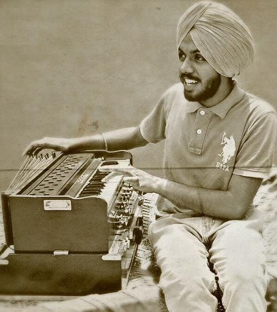 Satbir Aujla playing the Harmonium