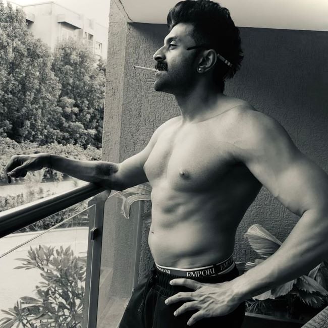 Sathya S. K. smoking a cigarette