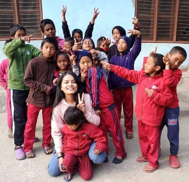 Savya KC with the children