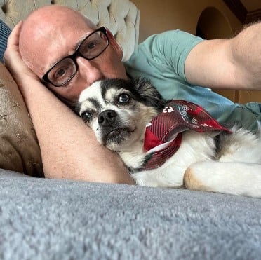 Scott Adams with his pet dog, Snickers