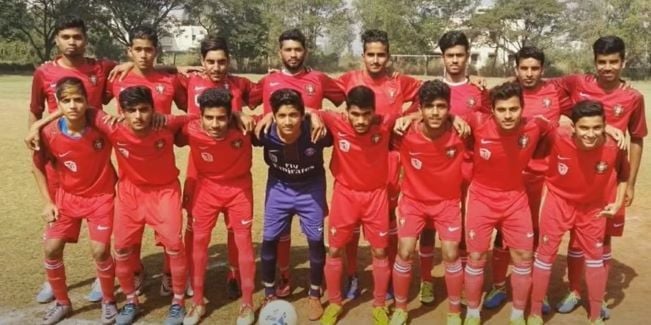 Scout OP (second from the top left) with his football team