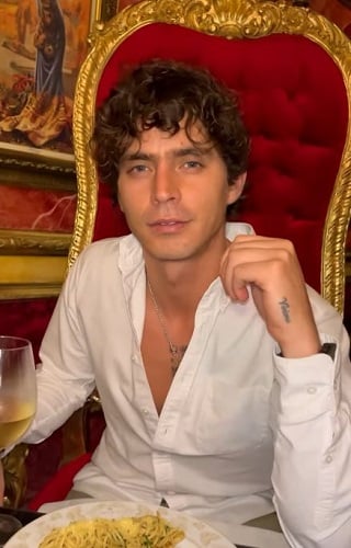 Sebastián Arias with a glass of wine