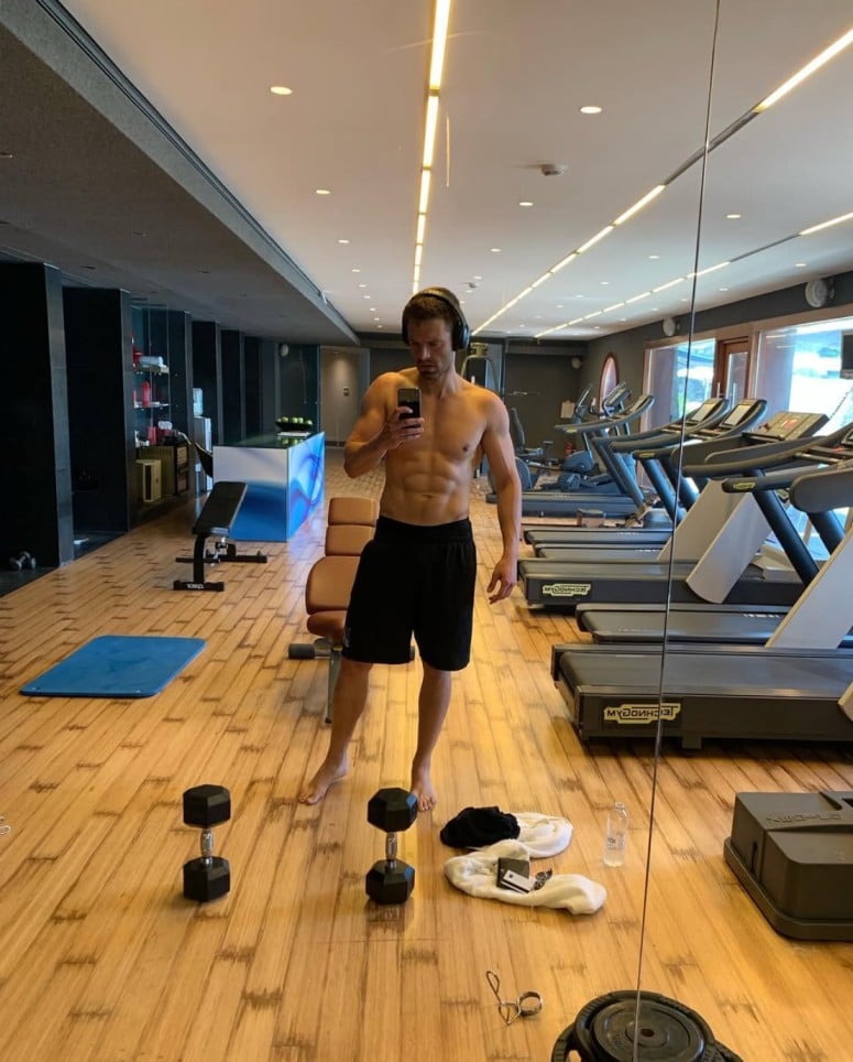 Sebastian Stan in a gym