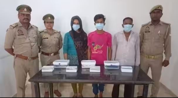 Sachin Meena with his lover, Seema Haider, and his father, Netrapal Singh, in police custody