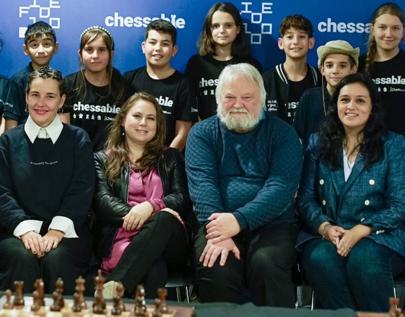 Sergey Sklokin with GM Judit Polgar and GM Artur Yusupov, along with other young chess prodigies at the FIDE Chessable Academy