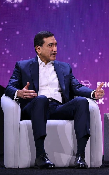 Shailesh Jejurikar speaking during a business conference