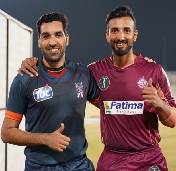 Shan Masood with Umar Gul (left) during a domestic tournament