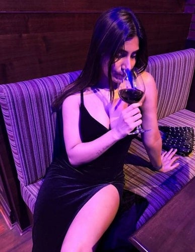 Shanu Dhekawa drinking wine