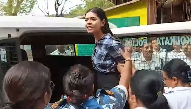 Sharmishta Panoli being taken out of court
