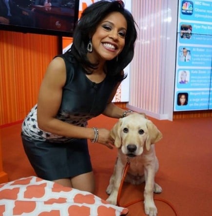 Sheinelle Jones posing with her pet