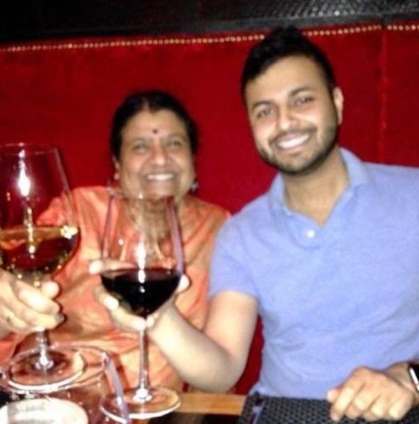 Shekar Jayaraman holding a glass of wine